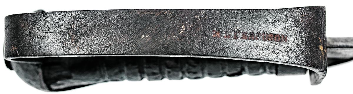 Ferguson’s maker mark on the outer surface of the knuckle bow of the knife.