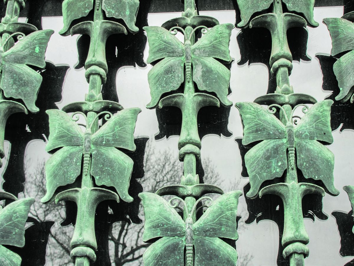 Ornate bronze butterflies are not only decorative but protect the glass windows.