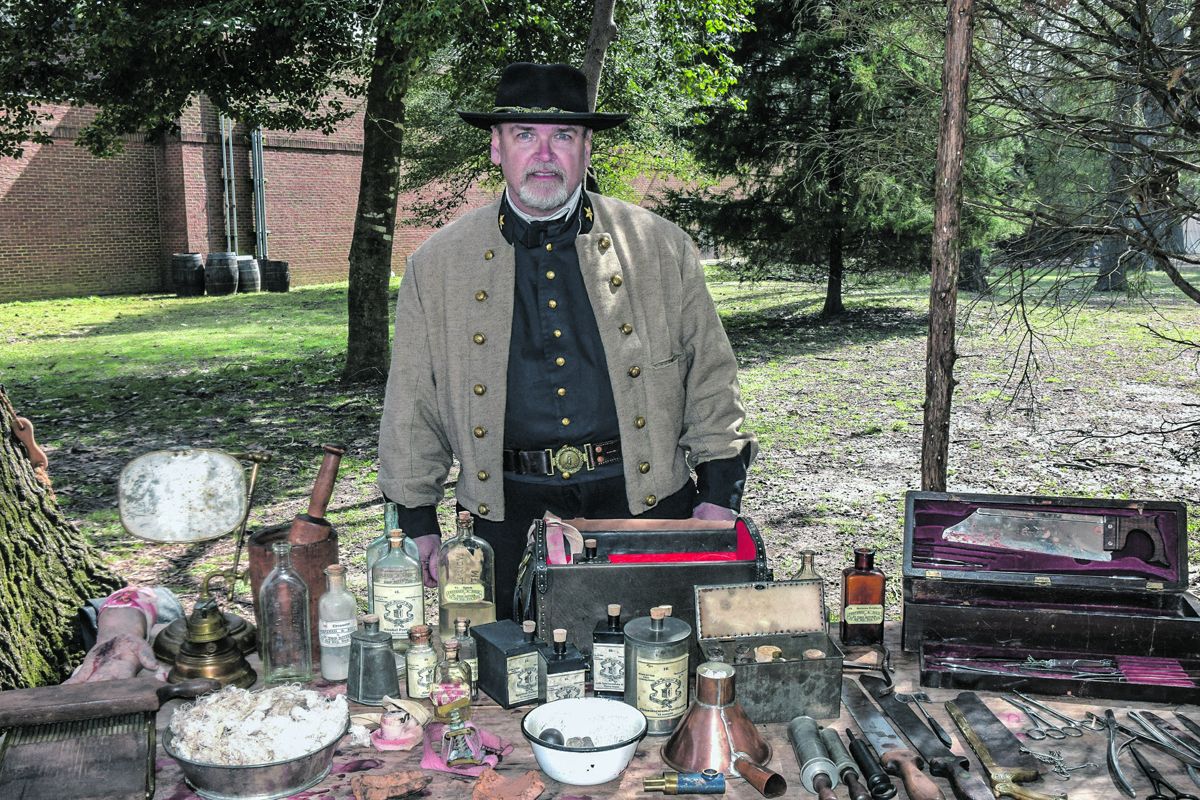 Harry Sonntag discussing the use of surgical instruments and medicines with visitors to the 2nd Corps Field Hospital.