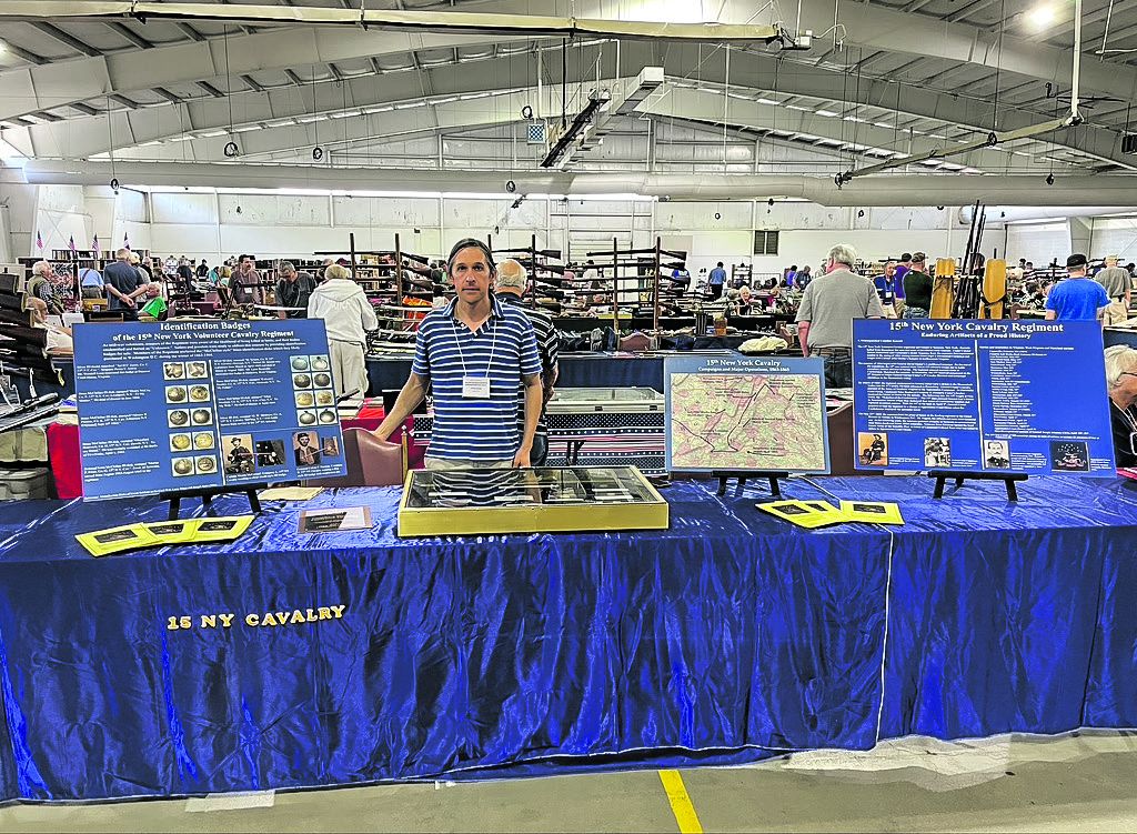 Author and collection James Crane III, poses with his Identification Badges display at the 48th annual Gettysburg Civil War Show. He was awarded an Appreciation award for his display.