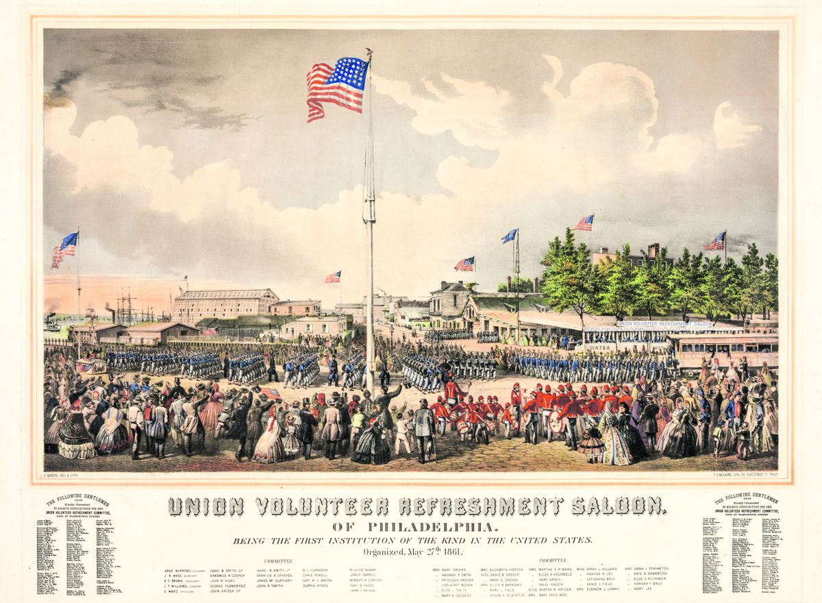 Print shows Union troops during the American Civil War disembarking from ferries in Philadelphia, having been transported across the Delaware River from New Jersey. They march in formation toward the Union Volunteer Refreshment Saloon, located at the southwest corner of Swanson and Washington avenues, cheered on by Philadelphians, who have lined up to watch. Troops that have eaten, board the “Philadelphia, Wilmington & Baltimore Railroad” to fight in the war. Barzilia S. Brown, a local grocer, organized the Saloon in 1861. Library of Congress.