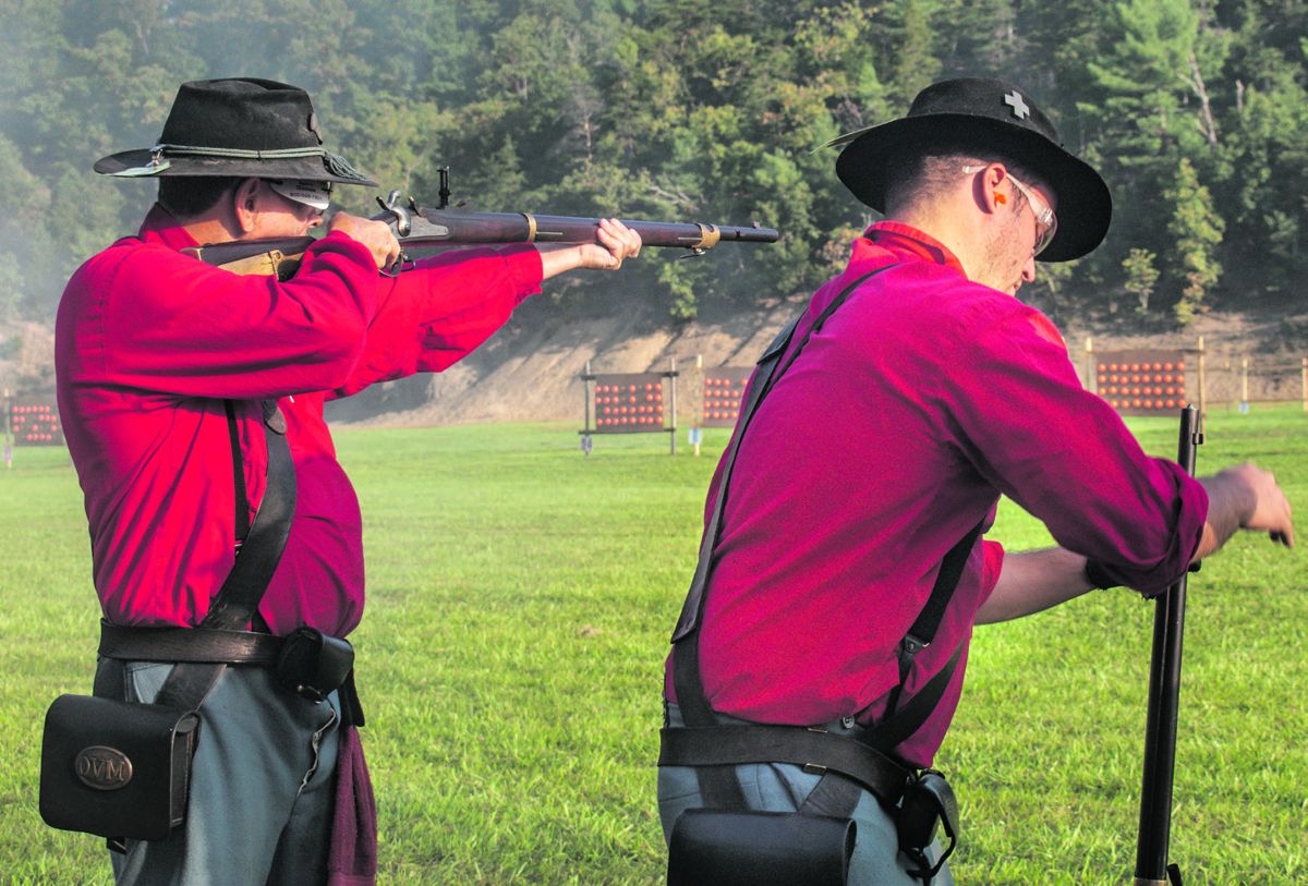 The 110th Ohio Volunteer Infantry (OVI) consistently wins first place in the N-SSA National Skirmish musket competition. Here, team members Mike Rouch and his grandson Michael Rouch compete in the musket match. Teams in this family-oriented organization often include multiple generations of family members. Ericka Hoffmann Curley.