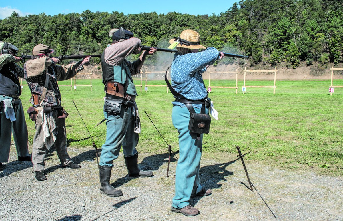 Members of the 1st Pennsylvania Rifles “Bucktails” and a member of Confederate team Hazlewood Volunteers work together to break pot silhouette targets during the smoothbore musket match. Sometimes, skirmishers from different teams will shoot together to make up a full team. Ericka Hoffmann Curley.