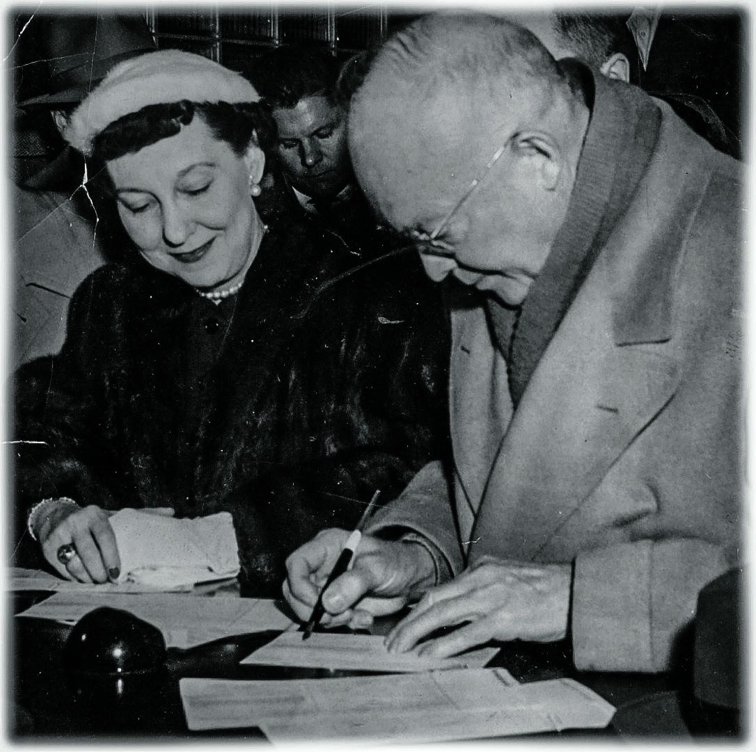 Ike and Mamie registering to vote holding the ACHS pen.