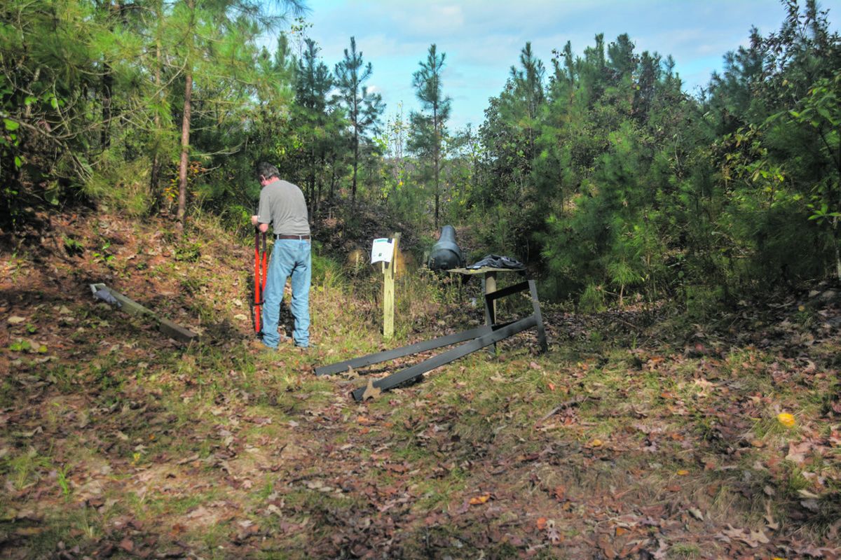 Digging post holes for sign.