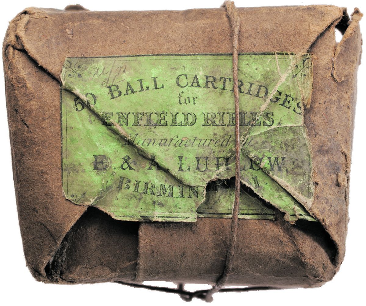 Paper wrapped Enfield cartridges. The label reads “ 50 BALL CARTRIDGES for ENFIELD RIFLES Manufactured by E. & A. LUDLOW, BIRMINGHAM.”