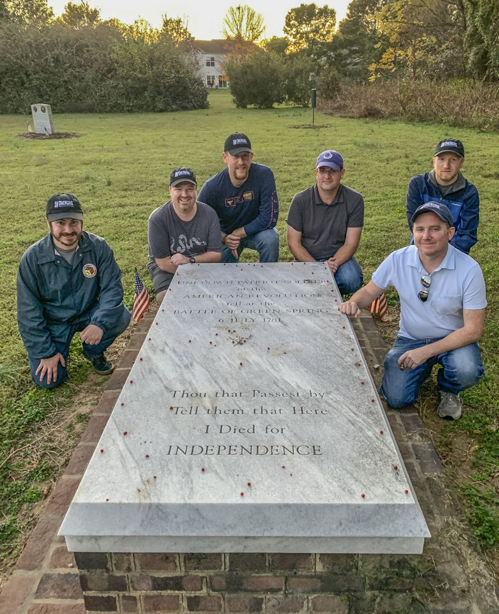 Emerging Revolutionary War historians visit the grave of an unknown soldier at Green Springs. From left: Billy Griffith, Dan Welch, Phill Greenwalt, Rob Orrison, Mark Malloy, and Kevin Pawlak.