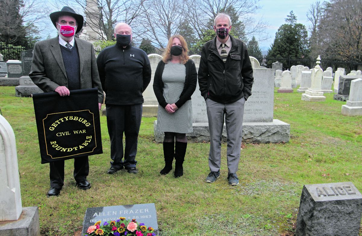 Gettysburg CWRT members at Frazer gravesite. (Left to right) is Davis, Hawthorne, Michele Hessler, and Smith. Photo by Leon Reed.
