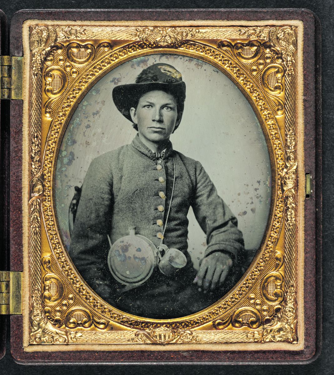 Unidentified young soldier in Confederate shell jacket, Hardee hat with Mounted Rifles insignia and plume with canteen and cup. Library of Congress. Liljenquist Family collection.