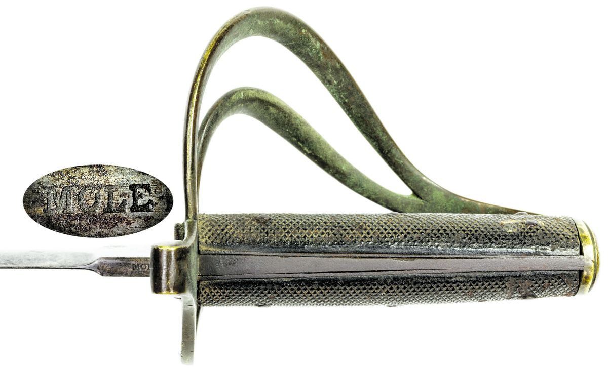 Courtney & Tennent mark on the reverse ricasso of the Mole-made naval cutlass. This same mark is found on both variants of the naval cutlass and on Mole’s “Dolphin Head” naval officer’s swords.