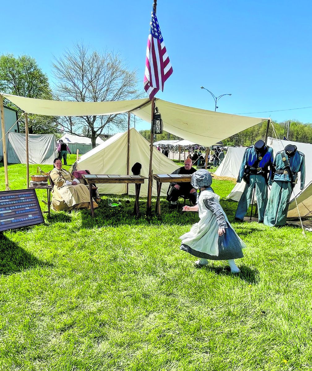 Living history and reenactor displays attract both young and old.