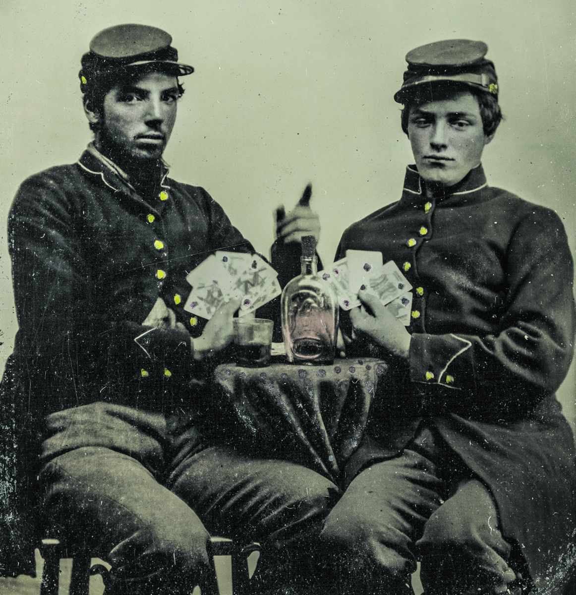 Staff of Gen. Fitz-John Porter posing in front of a tent with drinks, pipes, and a dog during the Peninsular Campaign, Va.; Lieutenant William G. Jones and Lieutenant George A. Custer in front. May 20, 1862. Library of Congress.