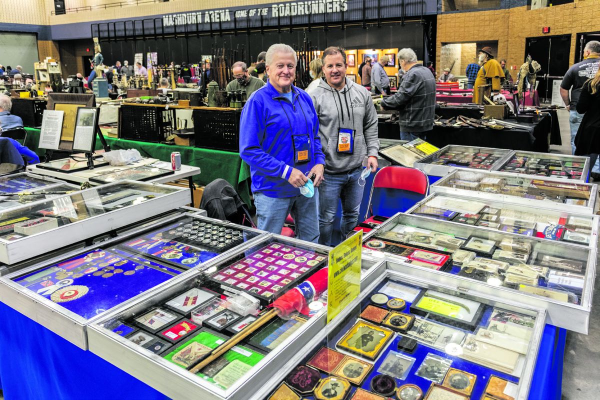 Everitt and Shane Bowles ready to start the day selling UDC/GAR and other reunion memorabilia.