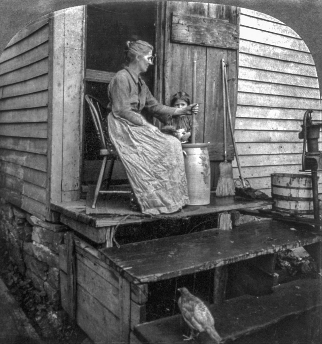 Woman and daughter with old-fashioned dasher churn, creamery, East Aurora, N.Y. Library of Congress.