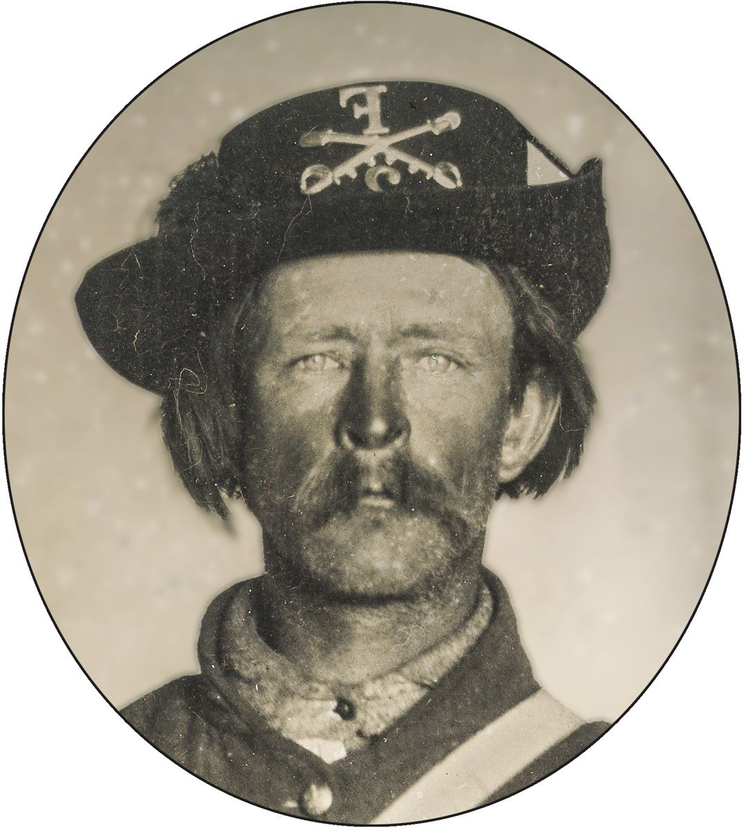 Enlargement of Union cavalryman in uniform with Hardee hat. Photograph shows cavalry insignia and 2nd Regiment Company F designation on Hardee hat. Is that dirt, black powder residue, or suntan on his face?