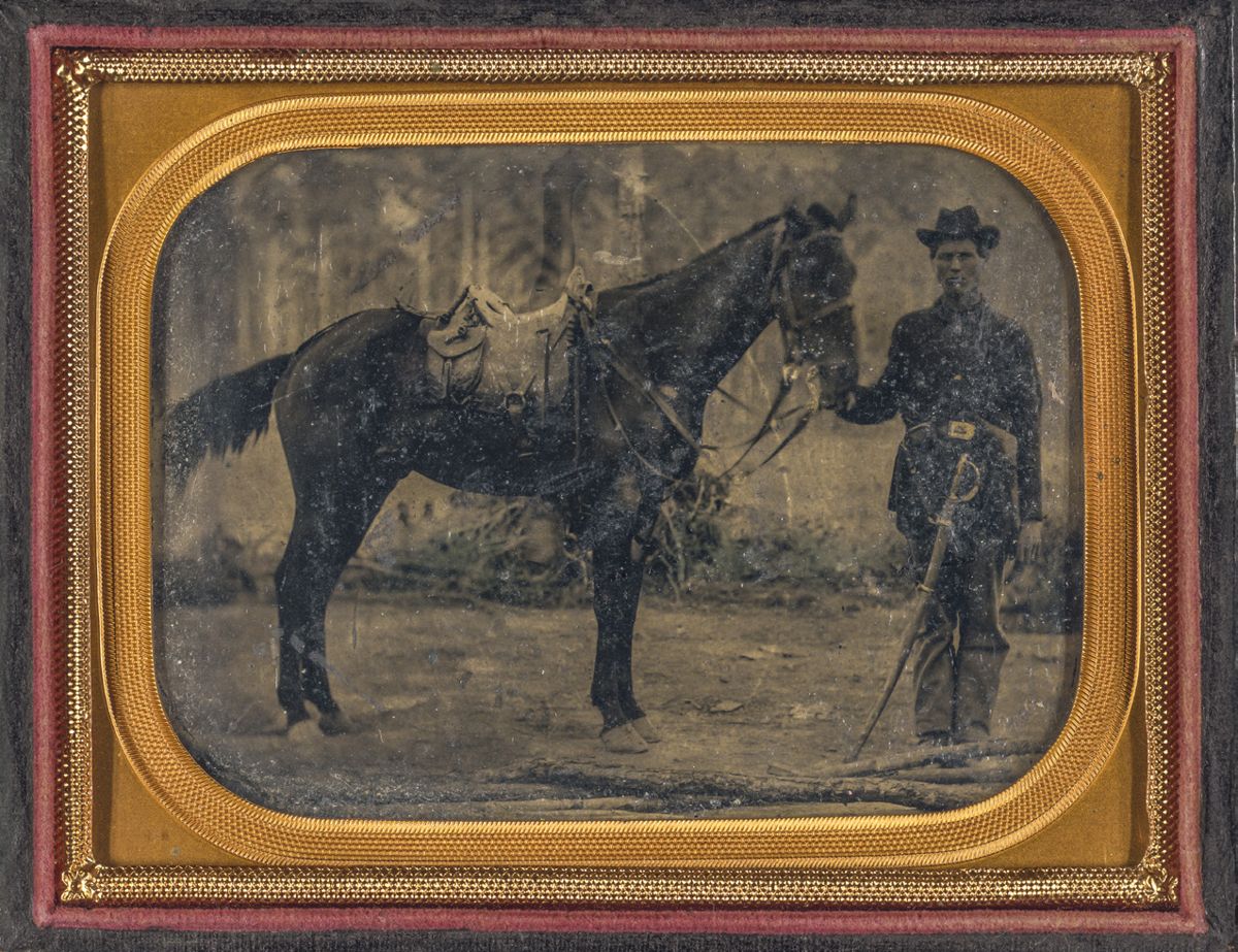 Union soldier in Union uniform with cavalry saber standing next to horse fitted with McClellan saddle. Liljenquist Family Collection of Civil War Photographs (Library of Congress)
