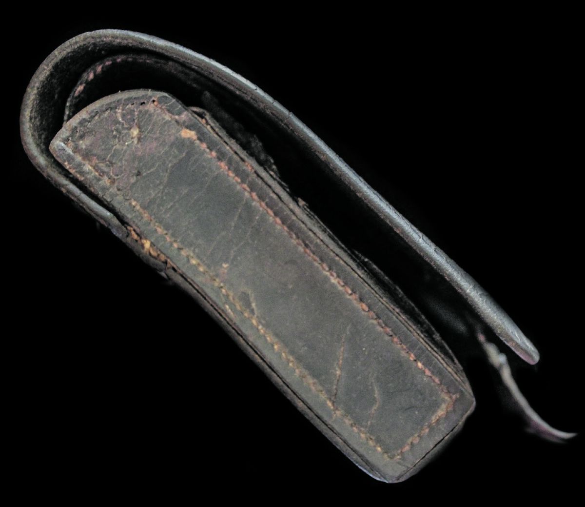 Left and right sides of the cartridge box showing the construction of the leather pieces sewn together.
