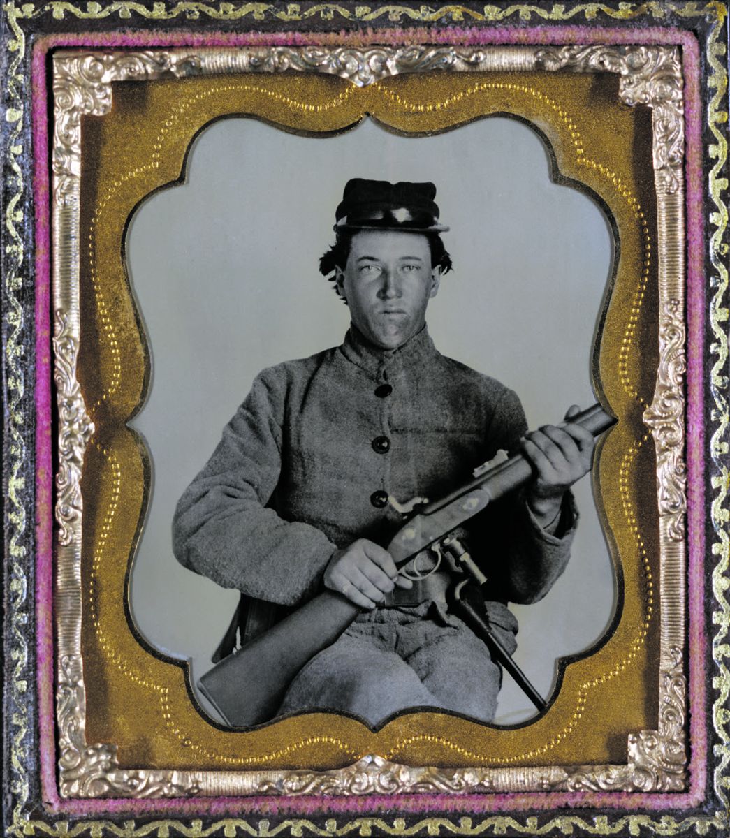 Confederate soldier holding a P53 Enfield rifle. Liljenquist Family Collection of Civil War Photographs (Library of Congress).
