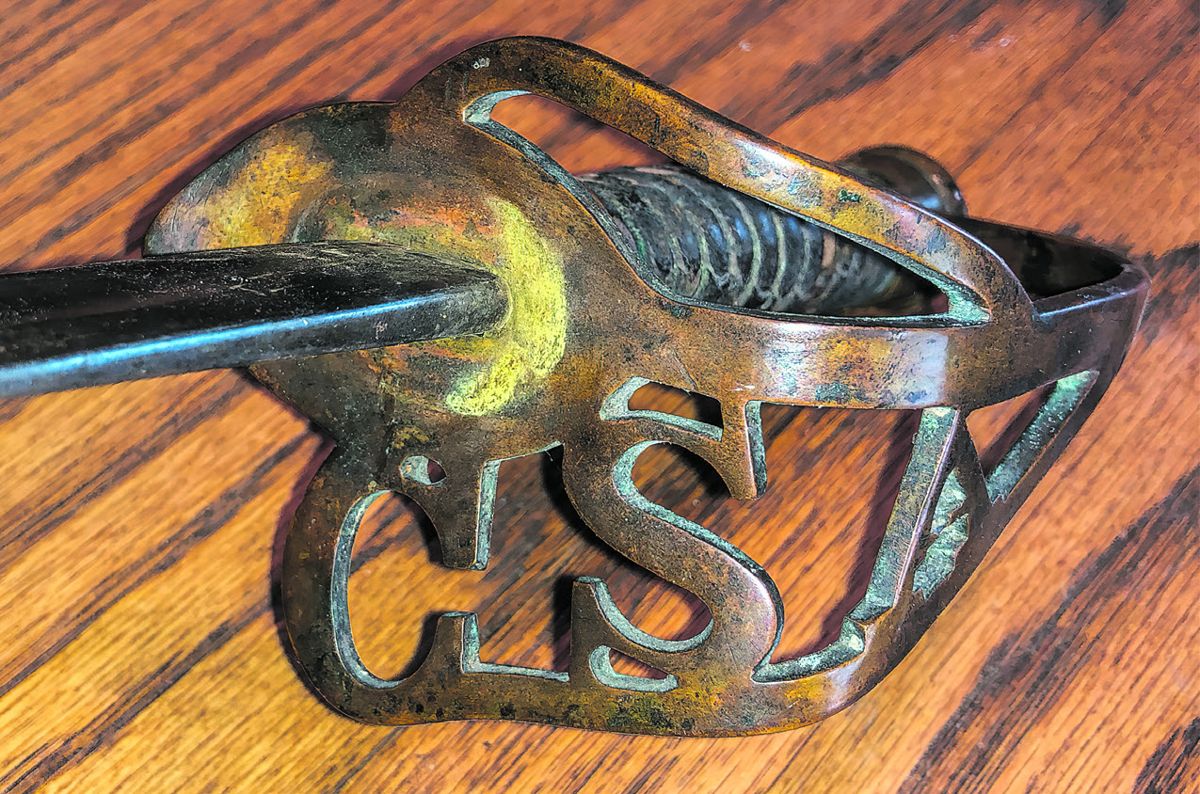 Beautiful chocolate brown patina found on brass hilt with cast CSA.