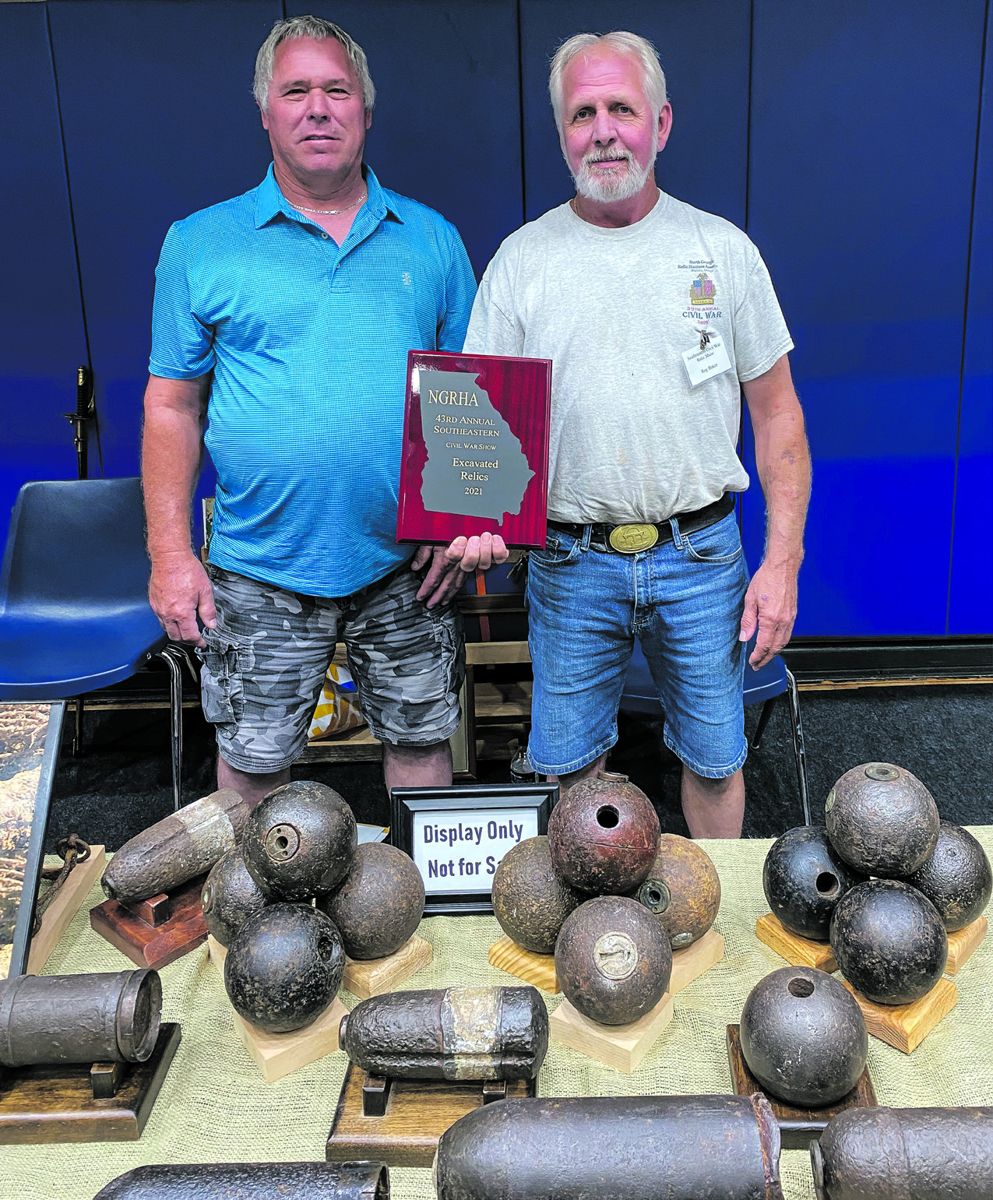 Excavated Relics Award went to Stan Wills and Roy Baker for their display of Civil War artifacts (including Union and Confederate buckles, buttons, and artillery projectiles) that they have metal detected mainly in Georgia.