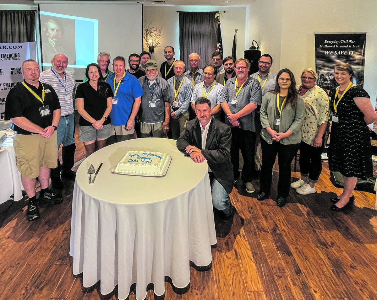 Some of the historians who make ECW happen on a day-to-day basis gathered for a group photo and some birthday cake (with Earl Van Dorn lurking over their shoulders). Hank Ballone.