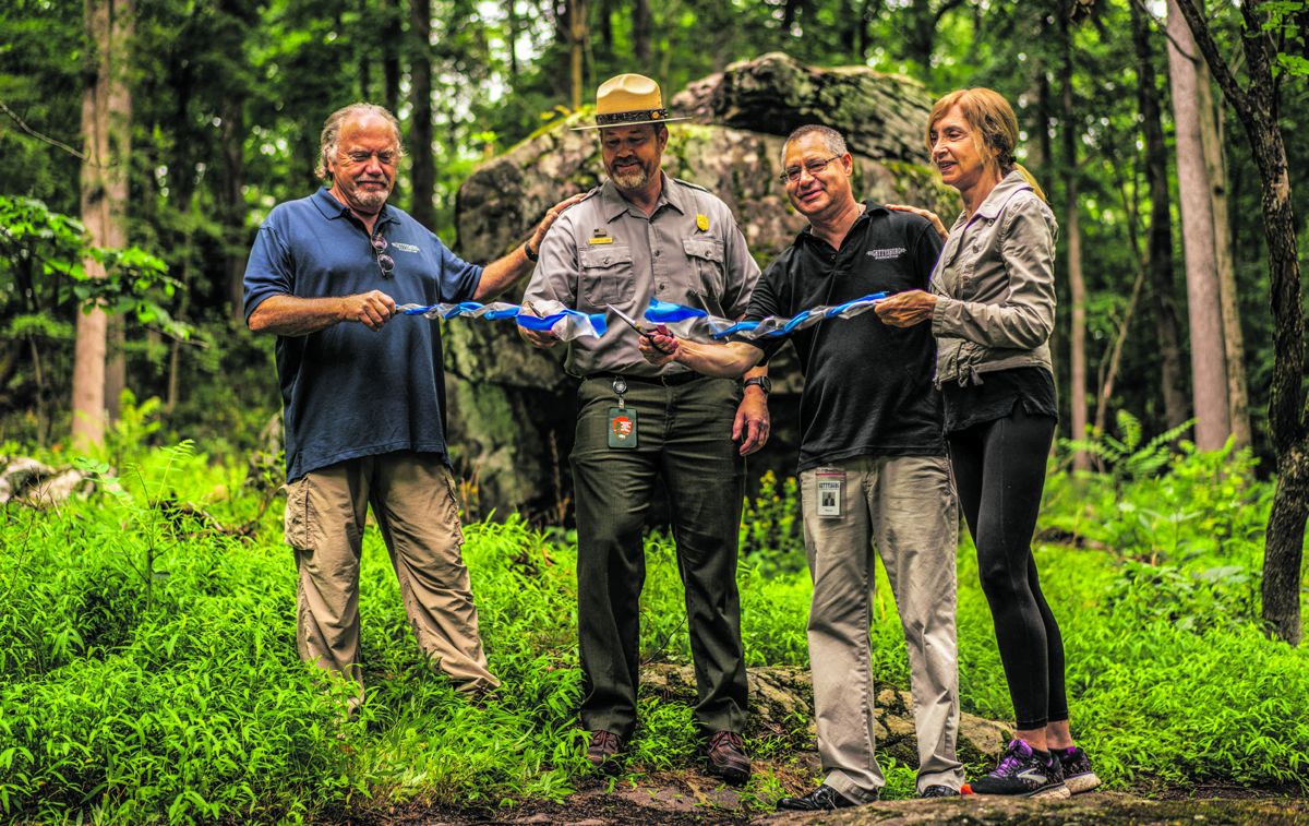 Culp’s Hill rehabilitation ribbon cutting, July 2021. Left to right: Gettysburg Foundation Board Member Cliff Bream, Gettysburg National Military Park Superintendent Steven Sims, Gettysburg Foundation President & CEO Wayne Motts, and Julie St. John.
