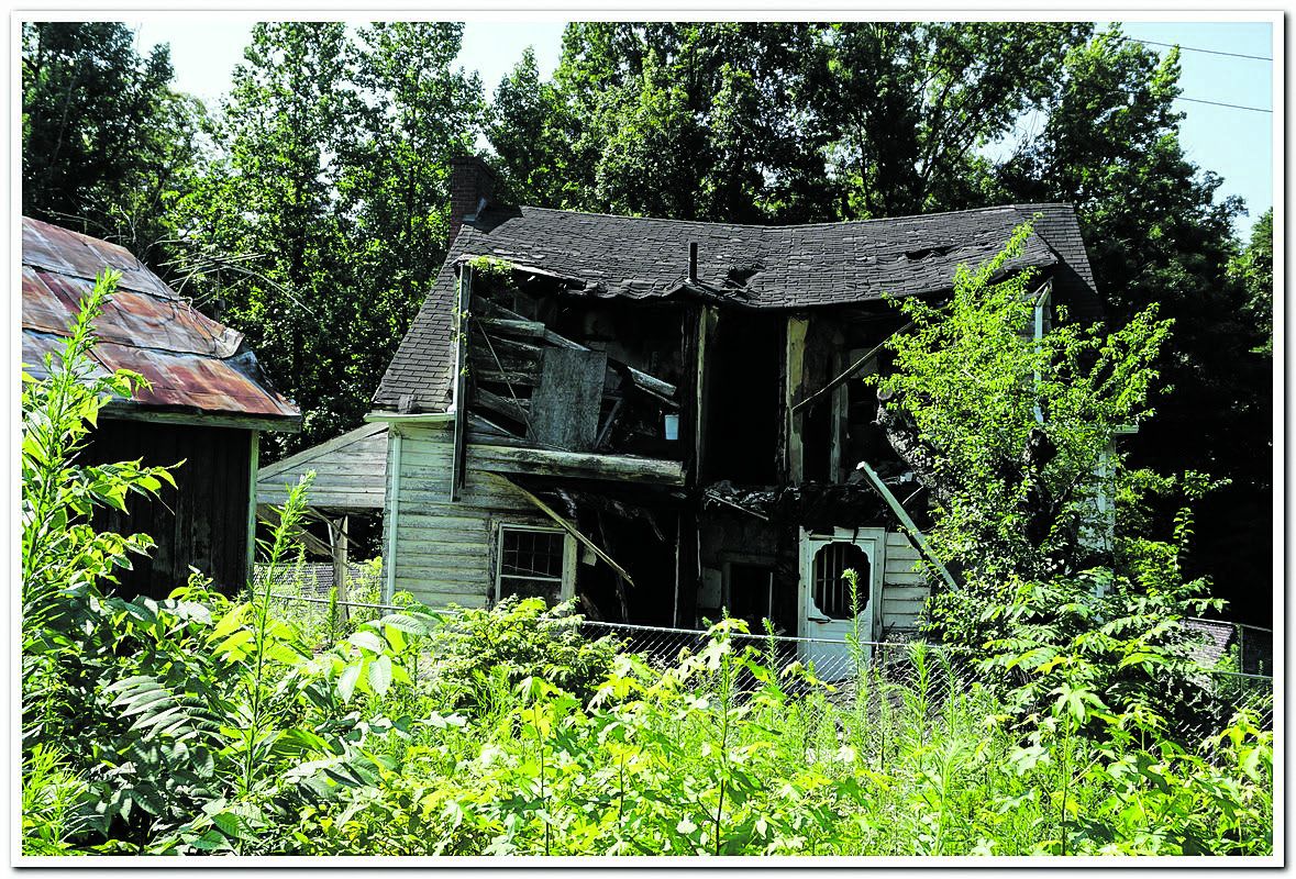 The Kinney House during its removal process as site was restored to historic greespace, making it easier for research and historic appreciation. (CVBT Archives)
