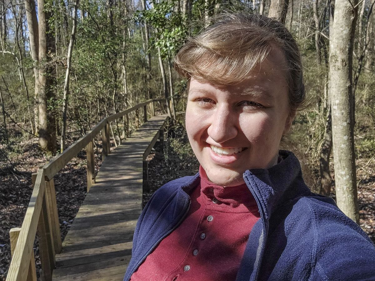 Sarha Kay Bierle stretches her legs on the trail at Bentonville.