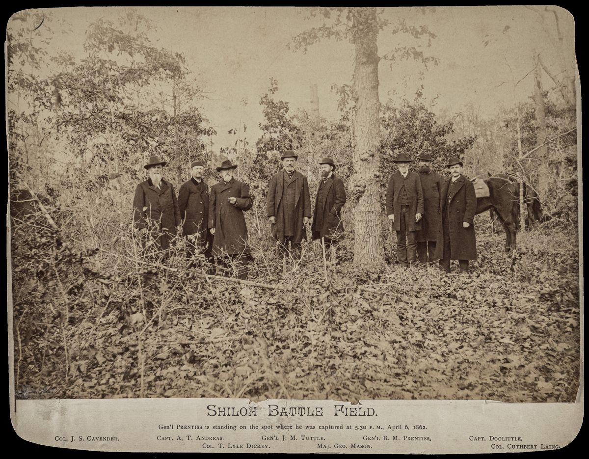 Shiloh Battle Field. / Gen'l Prentiss is standing on the spot where he was captured at 5.30 P.M., April 6, 1862. Union veterans identified as Col. J.S. Cavender, Capt. A.T. Andreas, Col. T. Lyle Dickey, Gen'l J.M. Tuttle, Maj. Geo. Mason, Gen'l B.M. Prentiss, Capt. Doolittle, and Col. Cuthbert Laing. Liljenquist Family Collection of Civil War Photographs (Library of Congress).