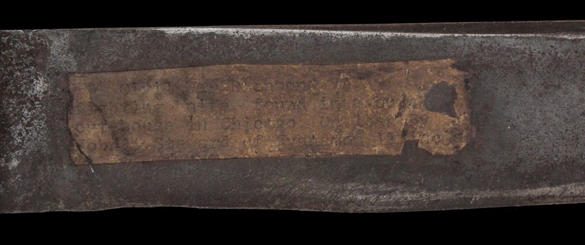 Though very hard to read with the naked eye, I could read the label pasted to the blade clearly under a microscope. I record it exactly as it is written, any letters that I could not clearly read I have entered [ ]. The top label has been digitally enhanced for easier reading.