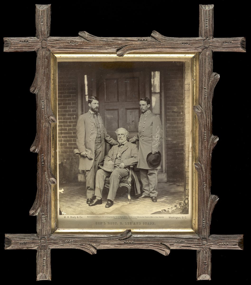 “Gen’l. Robt. E. Lee and staff / M.B. Brady & Co., Washington, D.C.” On verso: “General Robert E. Lee seated between his son, G. W. C. (Custis) Lee on his right and Lt. Colonel Walter H. Taylor on his staff. This picture taken by Brady in 1865 in the basement below the back porch of Lee’s Franklin Street home in Richmond, Virginia.”