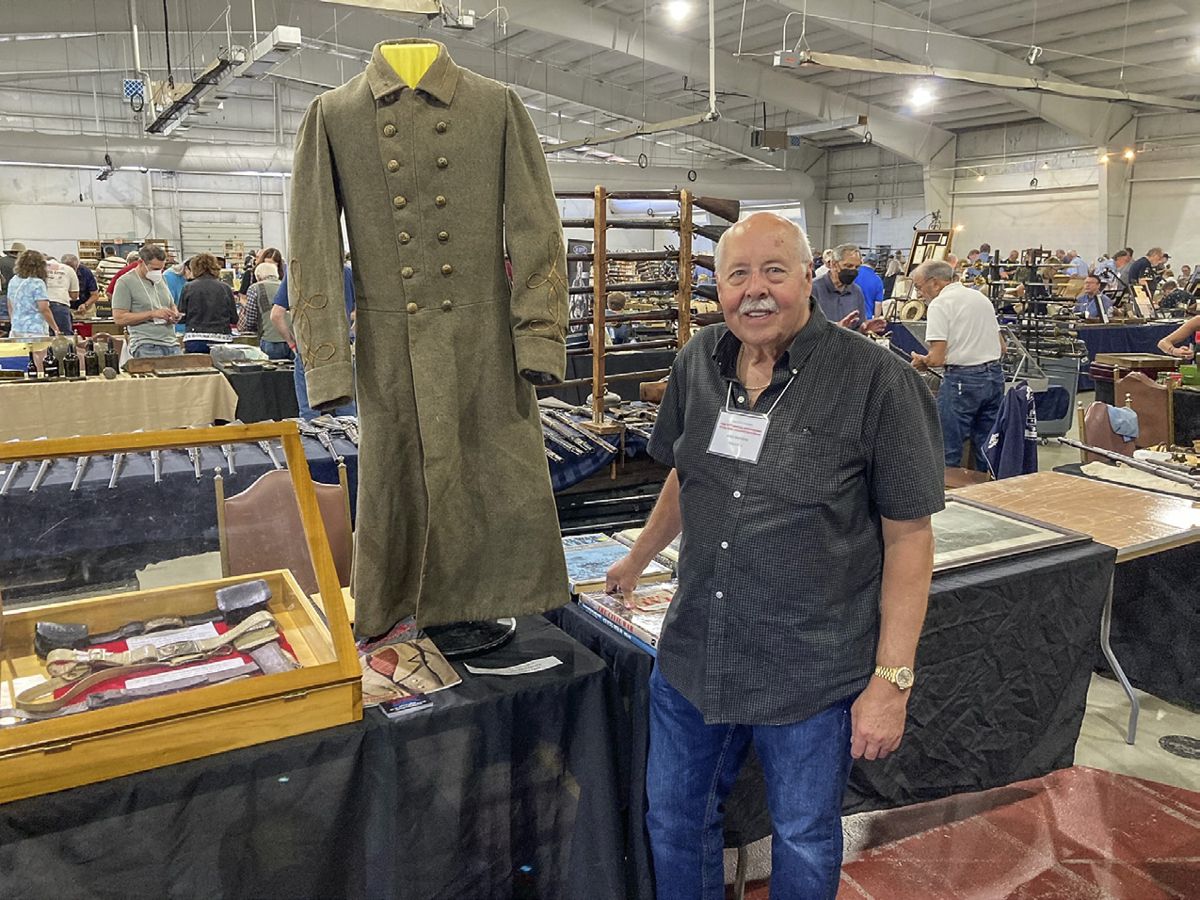 Allen Wandling with the Confederate overcoat worn by Samuel G. Bonn.