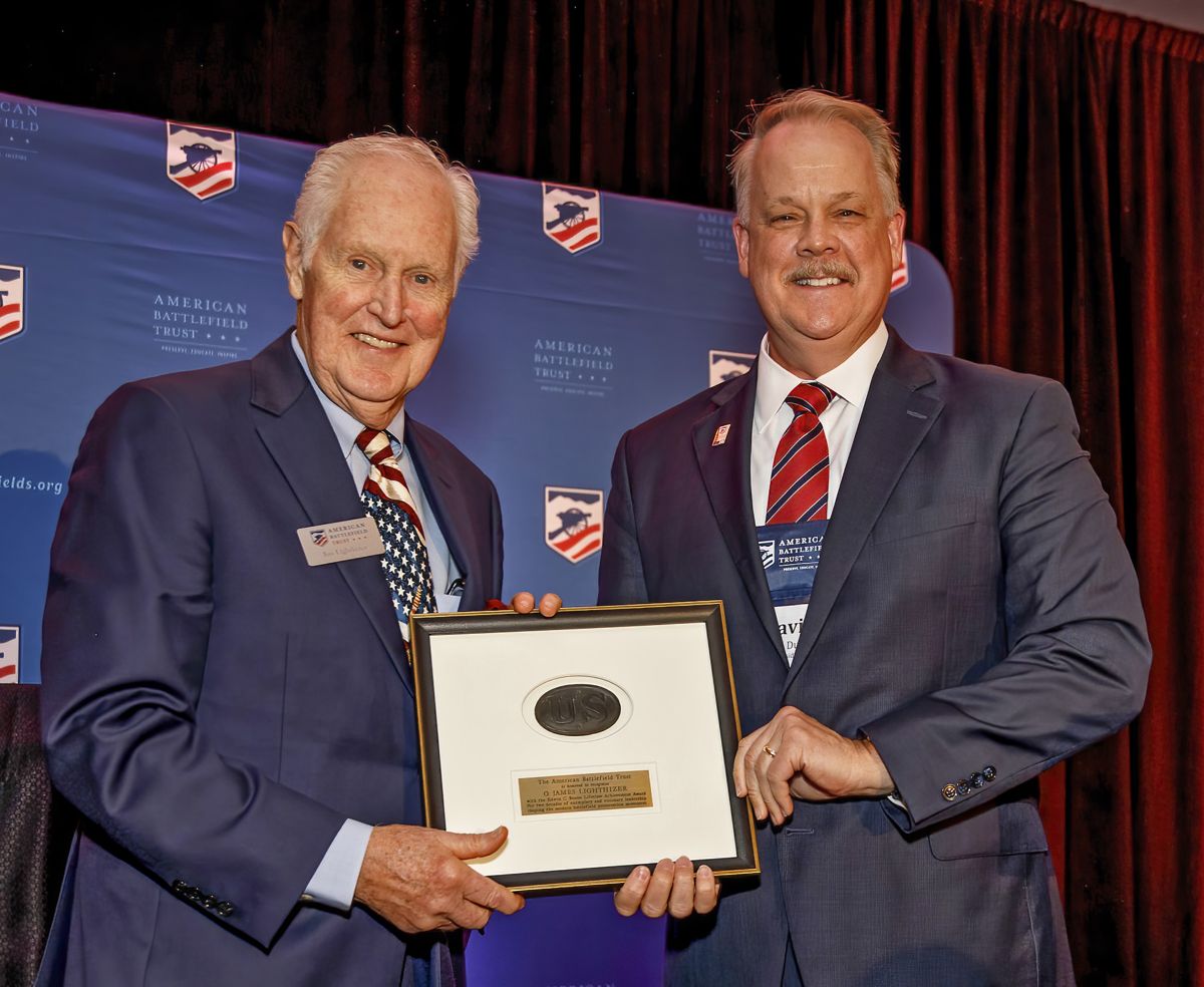 Jim Lighthizer (left) is presented with the Edwin C. Bearss Lifetime Achievement Award by successor David Duncan (right). (Buddy Secor)