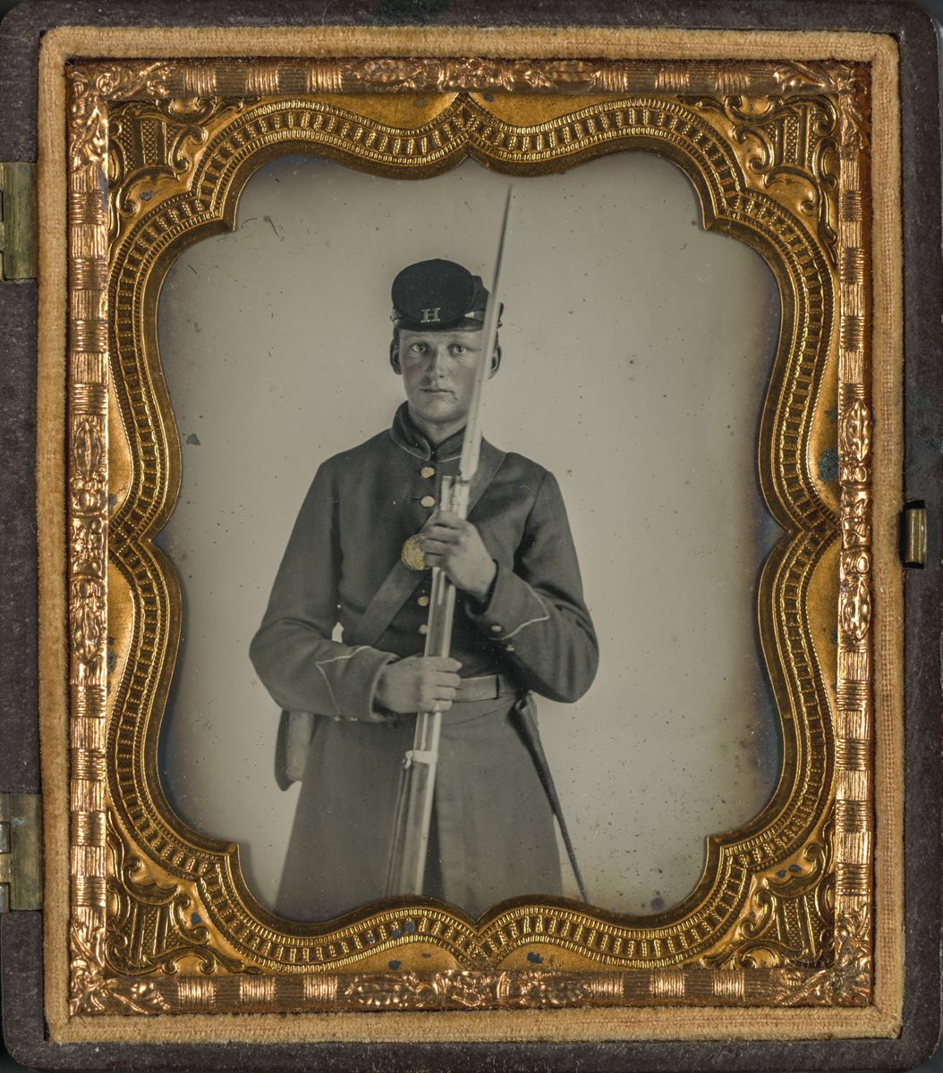 Union soldier in uniform with Company H hat insignia holding bayoneted musket. Liljenquist Family Collection of Civil War Photographs (Library of Congress).