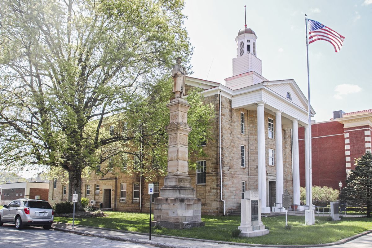 The Lewis County Court House with the Civil War monument. Flanking the flag pole are the World War I and World War II monuments.