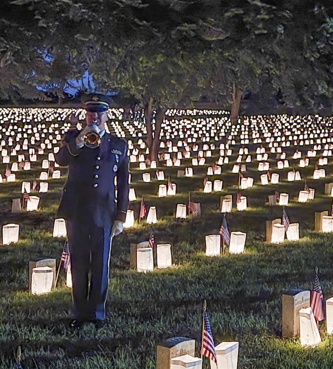 About five minutes before the final playing of Taps, the bugler played Tattoo. (Terry Rensel)