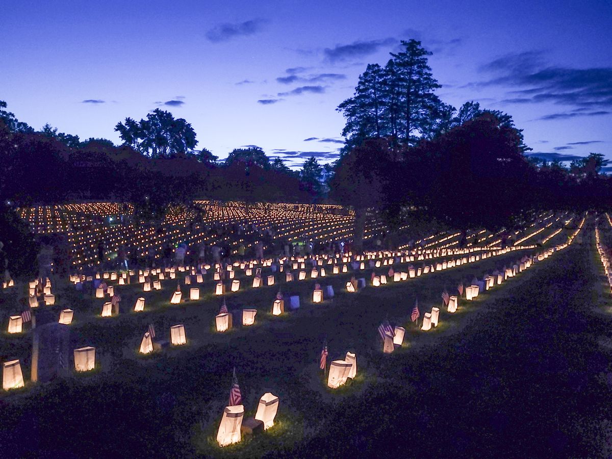 Local Scouts placed 15,300 candles on each grave in the cemetery. (Terry Rensel)