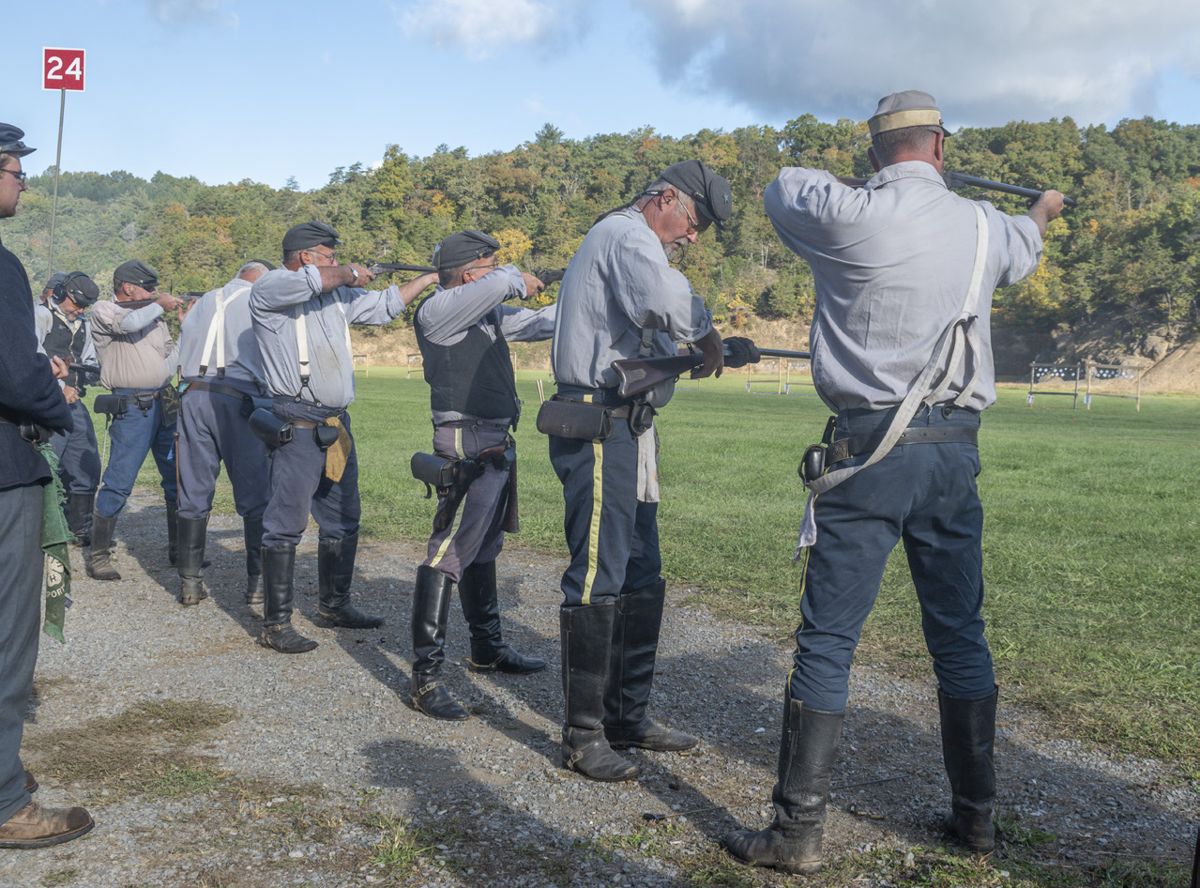Members of the 9th Virginia Cavalry, one of 119 competing carbine teams, skillfully fire at 16 hanging four-inch tiles placed at 50 yards. (Ericka Curley)