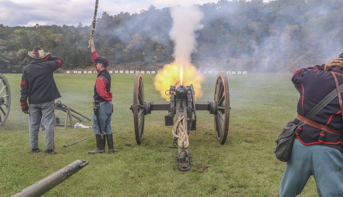 1st Maine Heavy Artillery’s 3-inch ordnance rifle erupts in flame after the number four position crewman set off the cannon fuse with slow-match on a linstock. (Niki