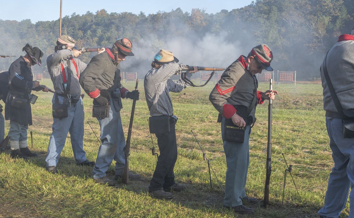 1st Stuart Horse Artillery starts to clear their targets in the first event of the Rifle Musket Match. Skirmishers come from all ages and backgrounds to work together as a team to hit all of their targets in the least amount of time. (Ericka Curley)