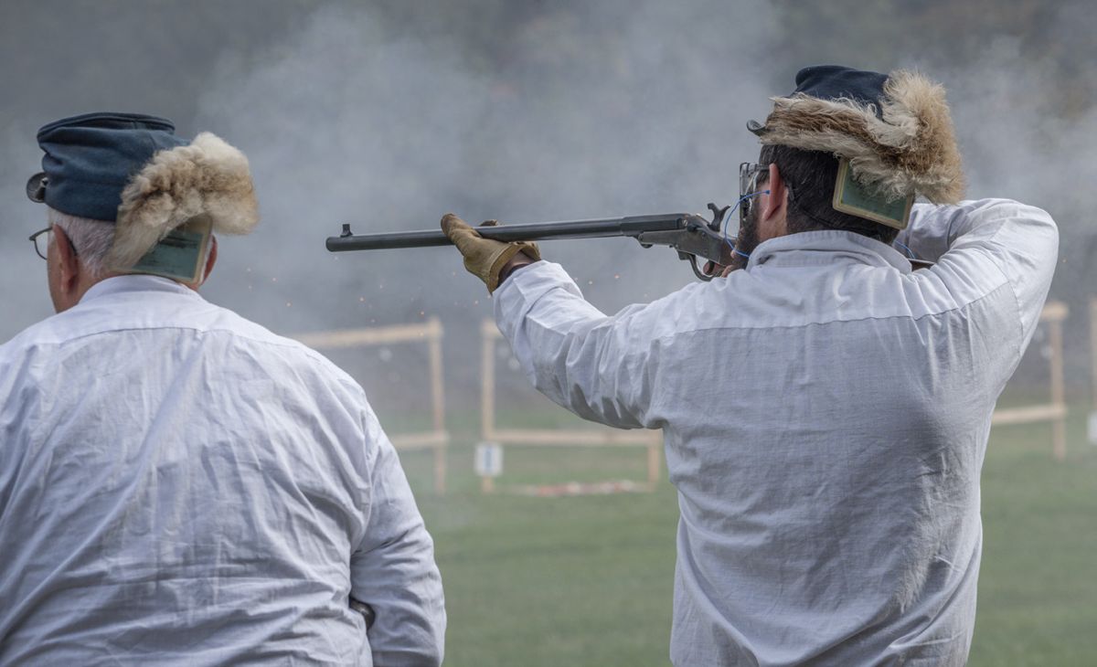 Aiming through the black powder smoke, Adam Bumford of the 149th Pennsylvania Volunteer Infantry sights his Maynard carbine. (Ericka Curley)