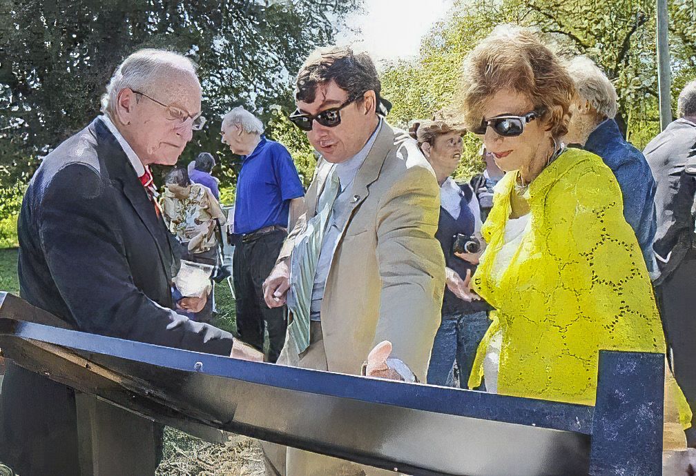 Coach Vince Dooley with Robert Jenkins and Barbara Dooley looking at Crow Valley Civil War historic marker, dedicated spring 2012.