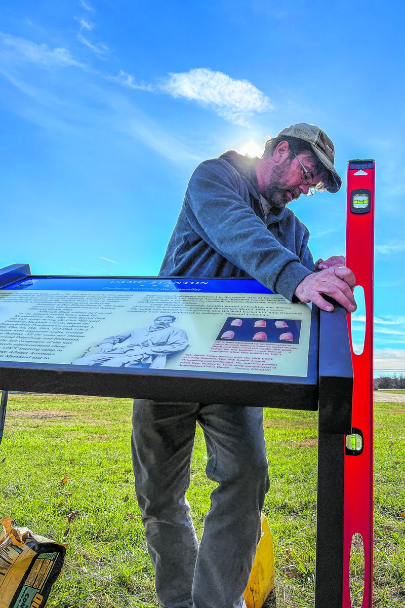 Jason Shaffer, Direction of Operations for Civil War Trails, Inc. levels the new interpretive sign which helps visitors better understand how the United States soldiers who trained here helped change the course of history. Courtesy Civil War Trails, Inc.
