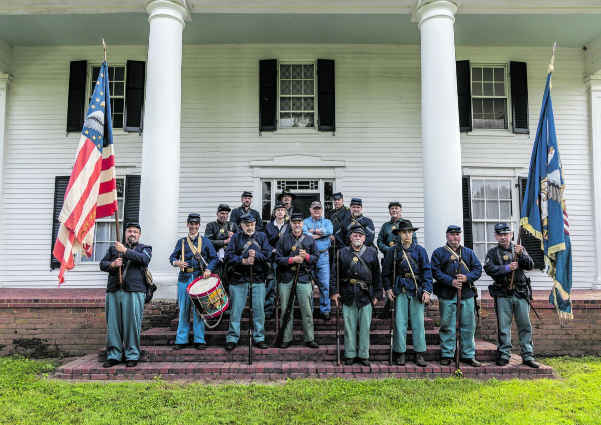 Members of the 14th and 8th Conn. on the steps and porch of the Robinson House, Struan. From left to right. First step: Charles Brooks (National Flag), Bob Boucher, Matt Gouin, Robert Tadduni, and Frank Durinick (Regimental Flag). Second step: Jacob Bates (drummer), Norman Graham, and Kim Perlotto. Third step: Donald Hamel, Ken Bernier, Clark “Bud” Hall, Dan Hayden, and Frank Niederwerfer. Fourth step: Kierran Broatch, Gordon Holcomb, and Ken Yeomans.