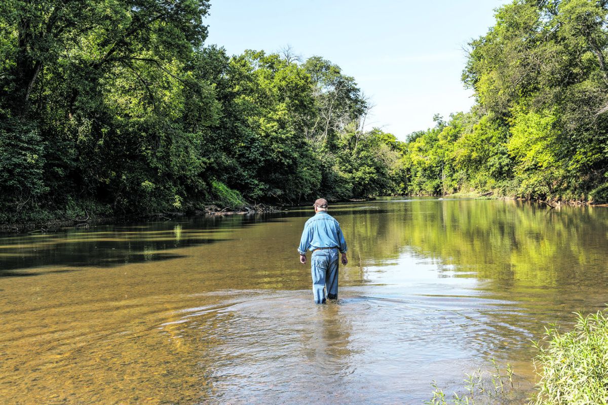 Bud Hall tests the waters for the best path to cross Morton’s Ford on the Rapidan River.