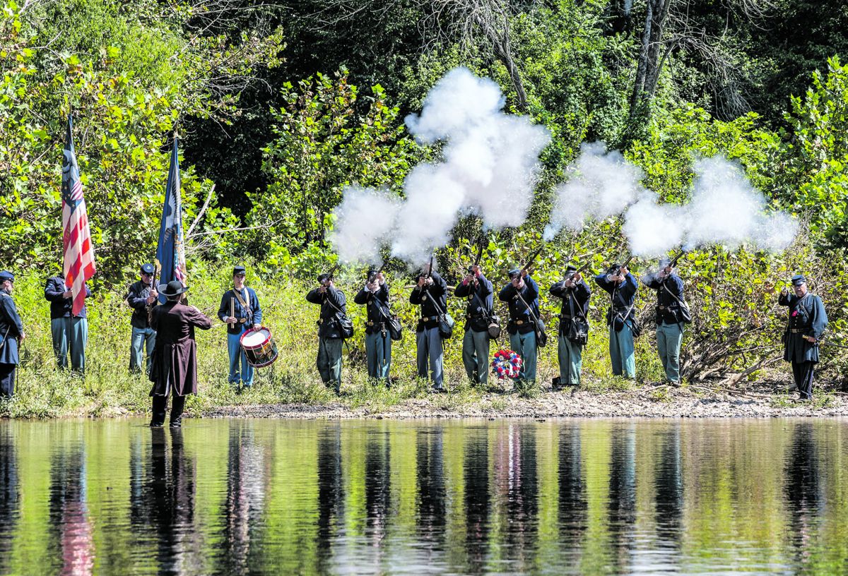 Above: Members of the 14th and 8th Conn. firing a salute after laying a wreath for the original regiment that crossed this spot on February 6, 1864.