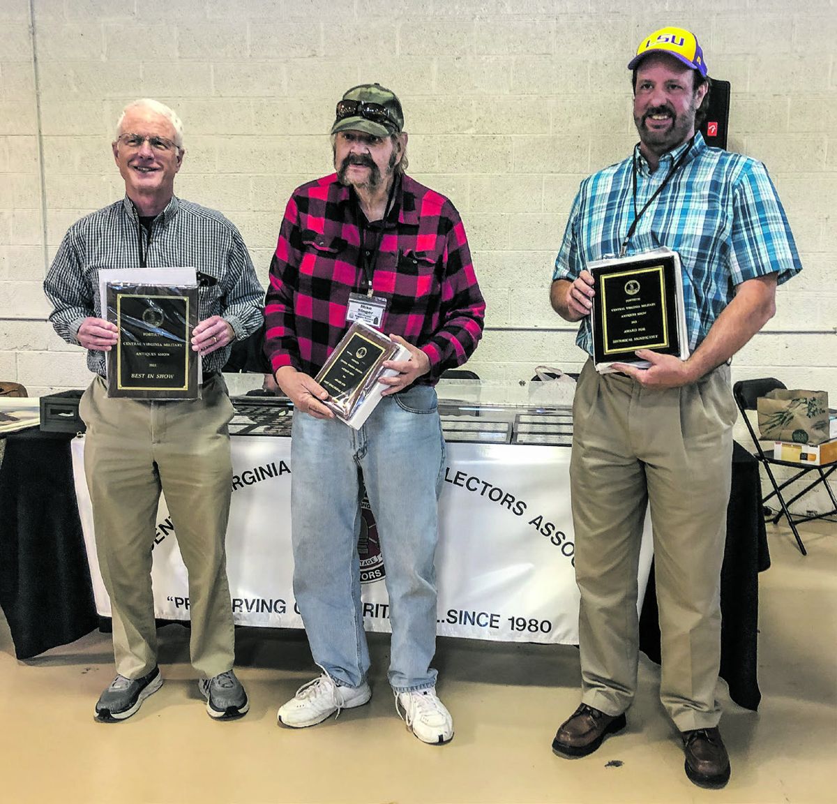 The award winning displays: (left to right) Bill Thompson (Best Of Show), Mike Singer (Most Educational), and Mike Wright (Historical Significance).