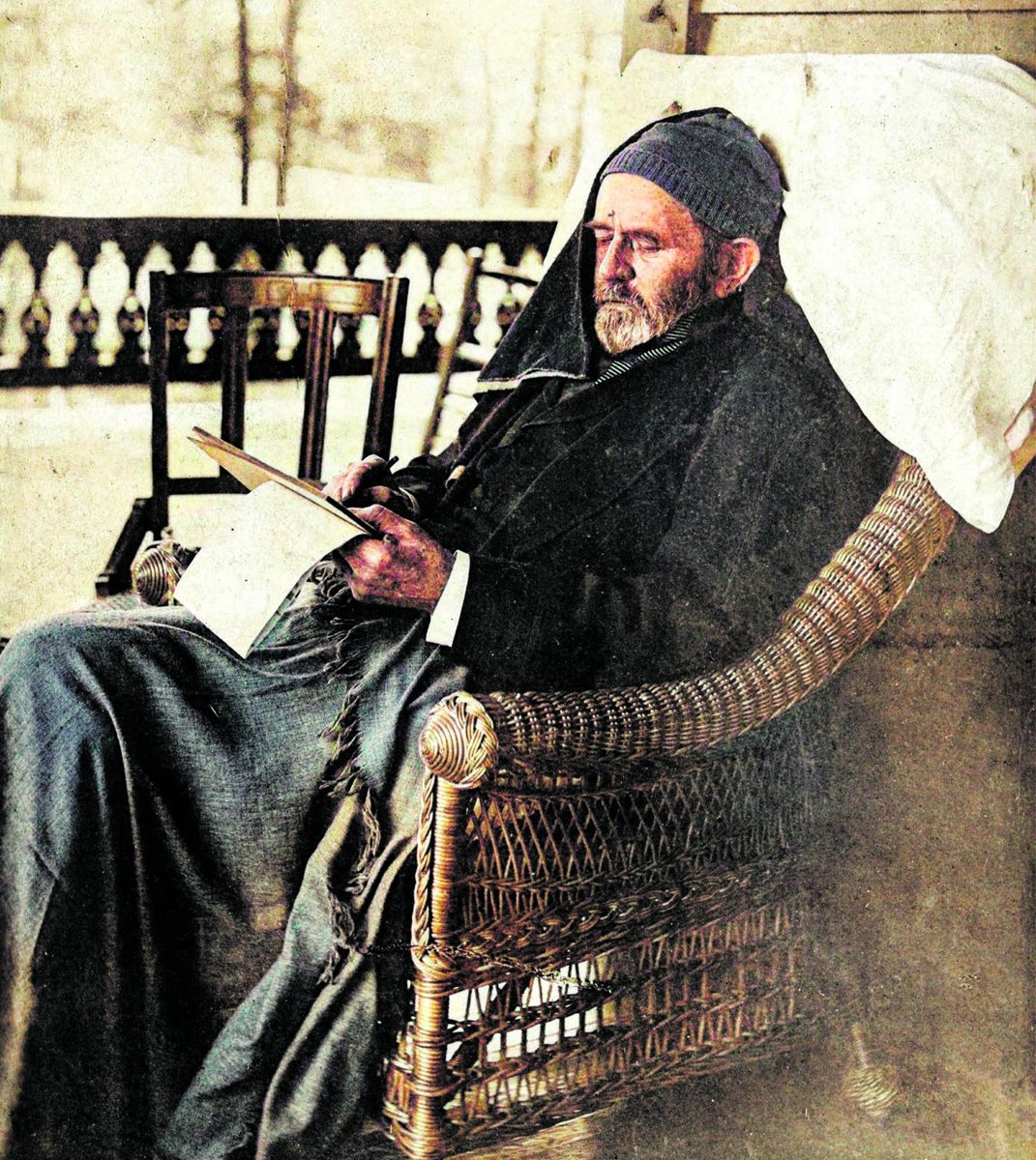 Grant writing his memoirs, 1885. Colorized by myheritage.com. (Library of Congress)