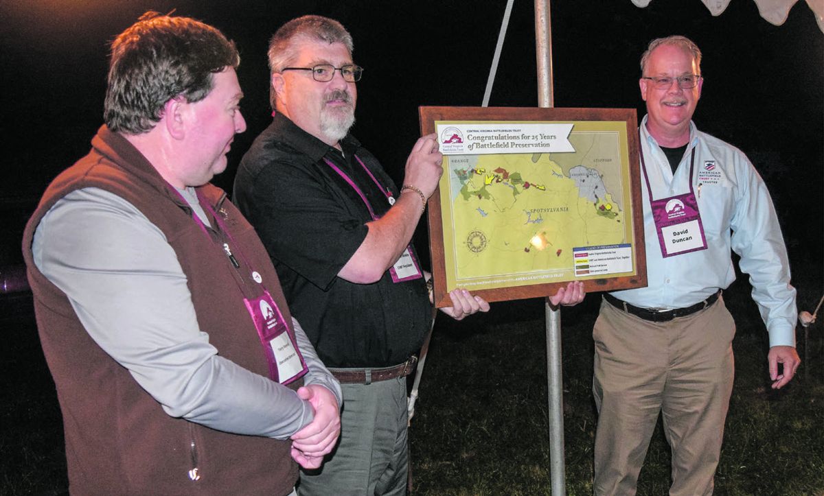 ABT President David Duncan (far right) CVBT President Tom Van Winkle (center) CVBT Executive Director Terry Rensel (left) ABT presentation to CVBT.