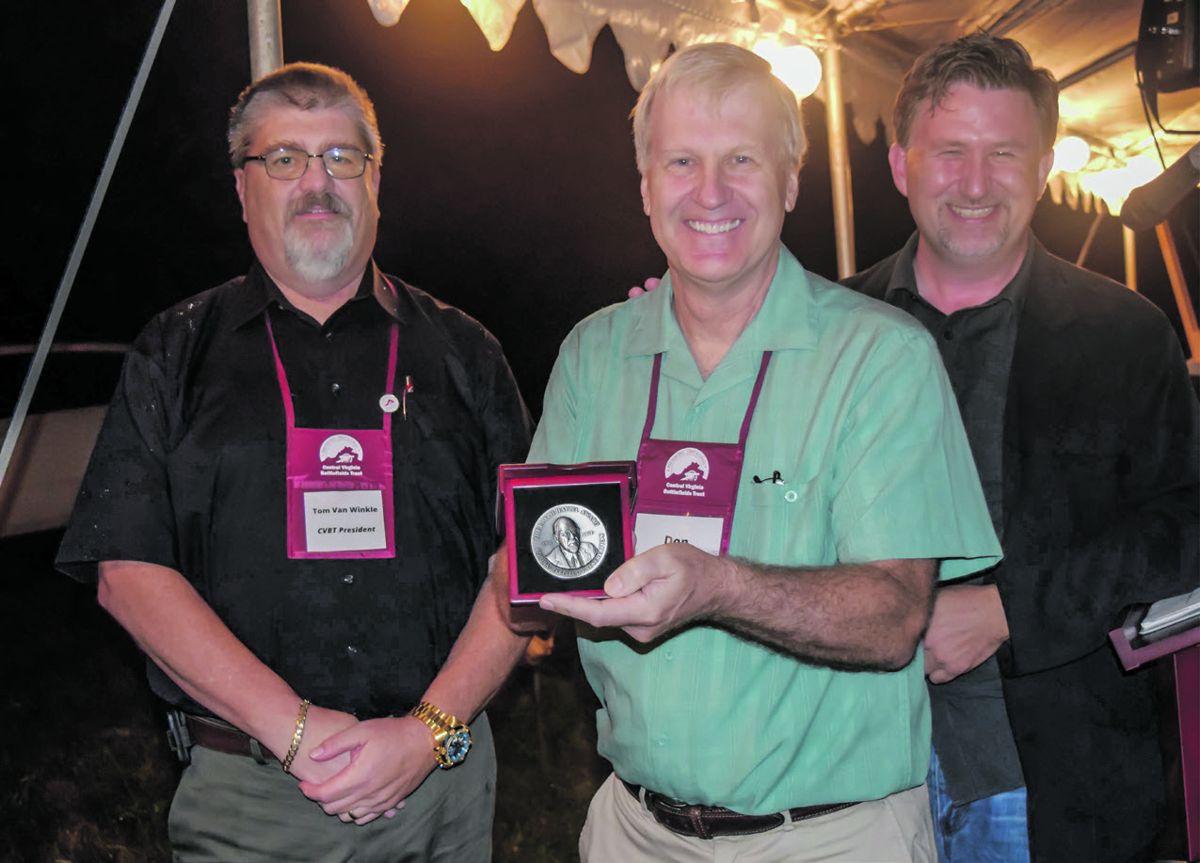 Donald Pfanz (center) receives CVBT’s Ralph Happel award. CVBT president Tom Van Winkle (left) CVBT Vice President Chris Makowski (right).